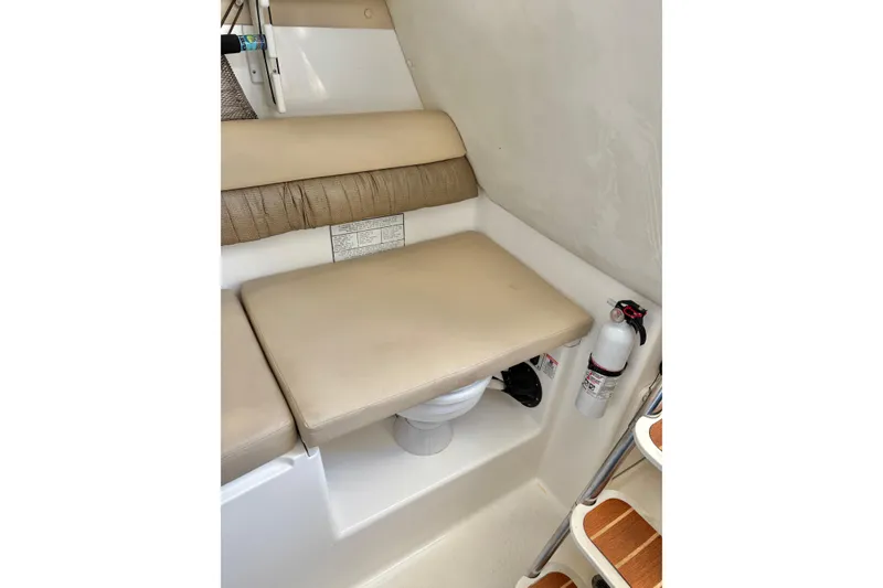 Slide: The Image of 2006 Century 2400 Walkaround cabin interior with seating and fire extinguisher. - 32