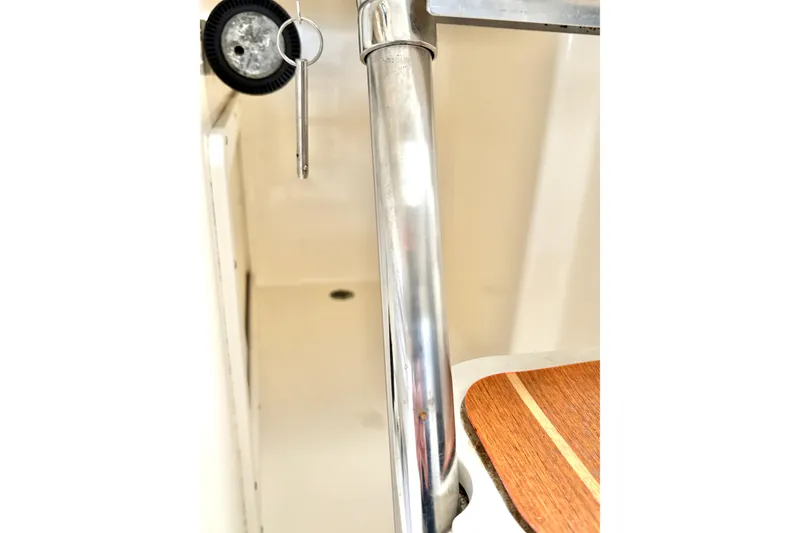 Slide: The Image of 2006 Century 2400 Walkaround interior detail with metal railing and wooden surface. - 33