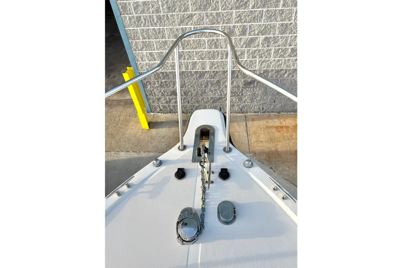 Slide: The Image of Bow of 2006 Century 2400 Walkaround boat with anchor and railing. - 7