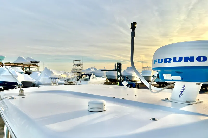 Slide: The Image of Century 2400 Walkaround 2006 boat with Furuno radar, docked at marina during sunset. - 8