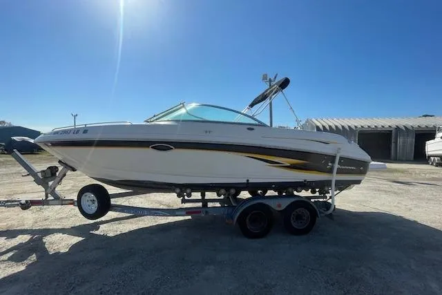 Slide: The Image of 2001 Chaparral 230 SSi boat on trailer under clear blue sky. - 1