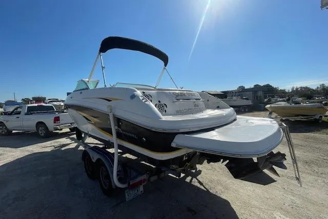 Slide: The Image of 2001 Chaparral 230 SSi boat on trailer under clear blue sky. - 2