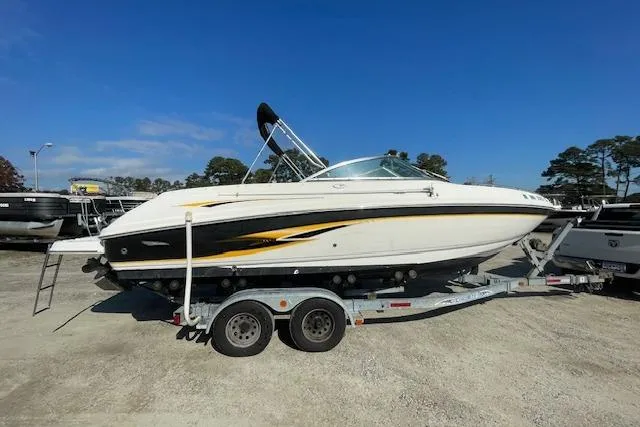 Slide: The Image of Chaparral 230 SSi 2001 boat on trailer under clear blue sky. - 5