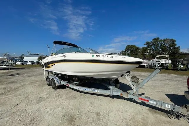 Slide: The Image of 2001 Chaparral 230 SSi boat on trailer in outdoor storage area. - 6