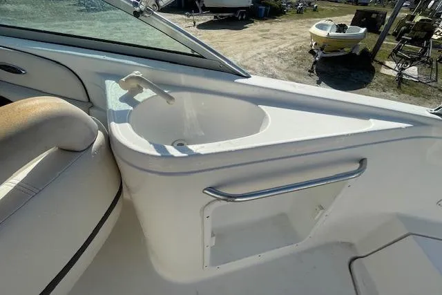 Slide: The Image of 2001 Chaparral 230 SSi boat interior with sink and seating area. - 8