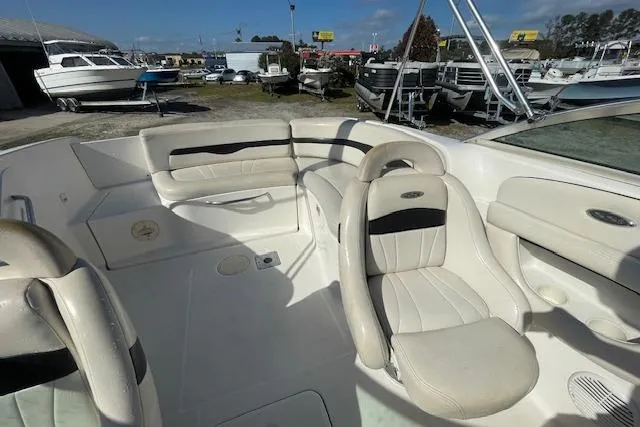 Slide: The Image of 2001 Chaparral 230 SSi boat interior with white leather seating and spacious layout. - 9