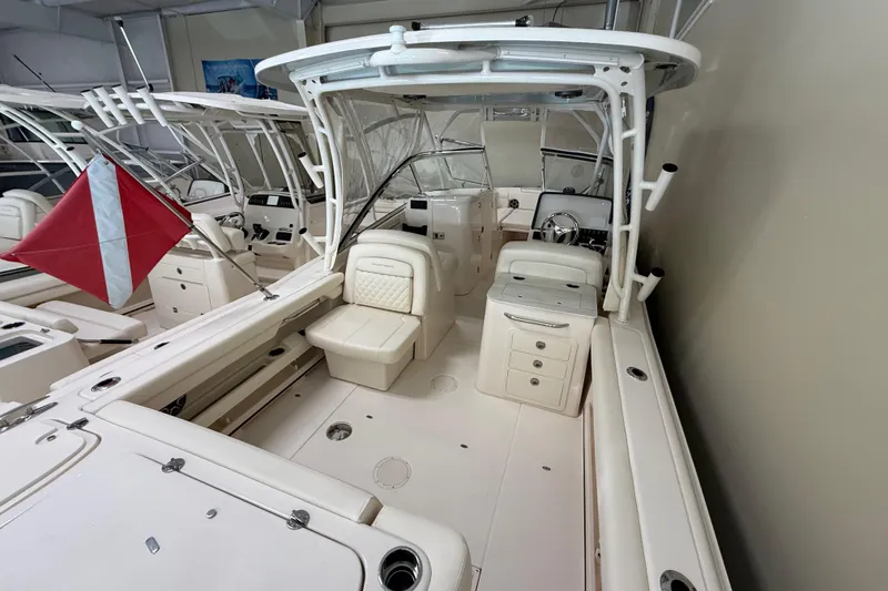 Slide: The Image of 2026 Grady-White Freedom 275 boat interior with seating and storage compartments. - 14