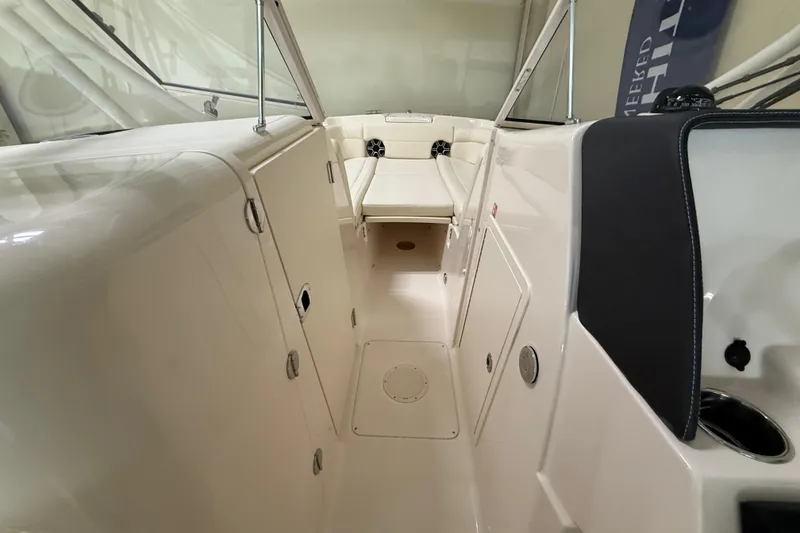 Slide: The Image of 2026 Grady-White Freedom 275 boat interior with seating and storage compartments. - 19