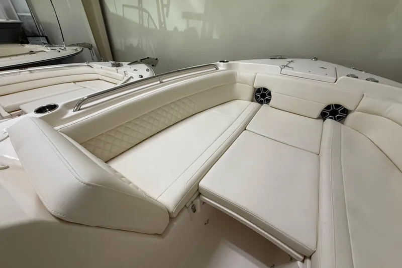 Slide: The Image of Luxurious seating on 2026 Grady-White Freedom 275 boat, featuring elegant white upholstery. - 20