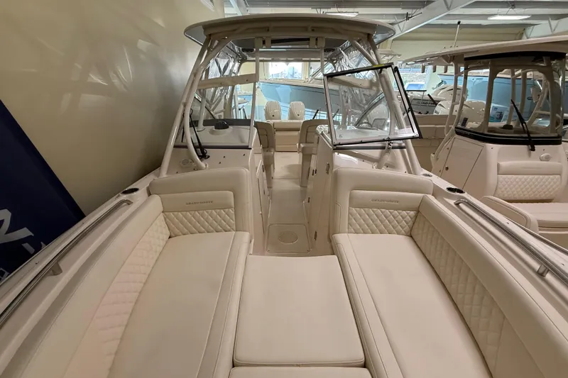Slide: The Image of 2026 Grady-White Freedom 275 boat interior with luxurious seating and helm station. - 22
