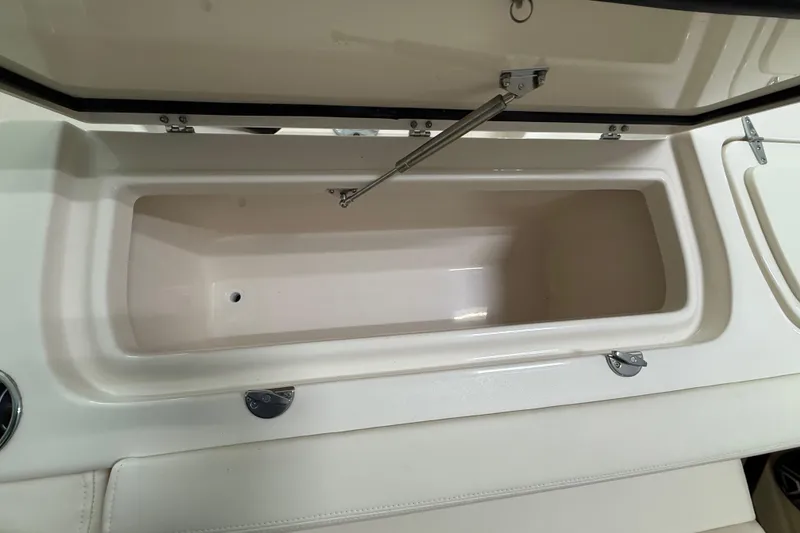 Slide: The Image of Open storage compartment on 2026 Grady-White Freedom 275 boat. - 28