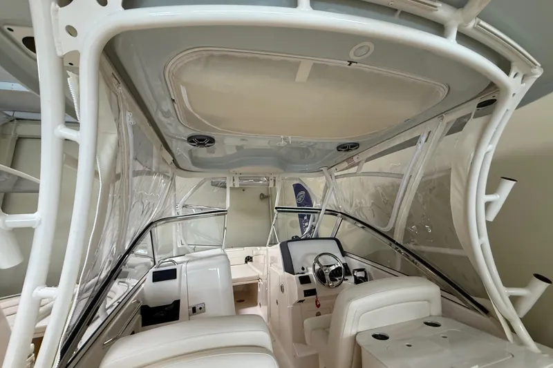 Slide: The Image of Interior view of 2026 Grady-White Freedom 275 boat, featuring helm and seating area. - 30