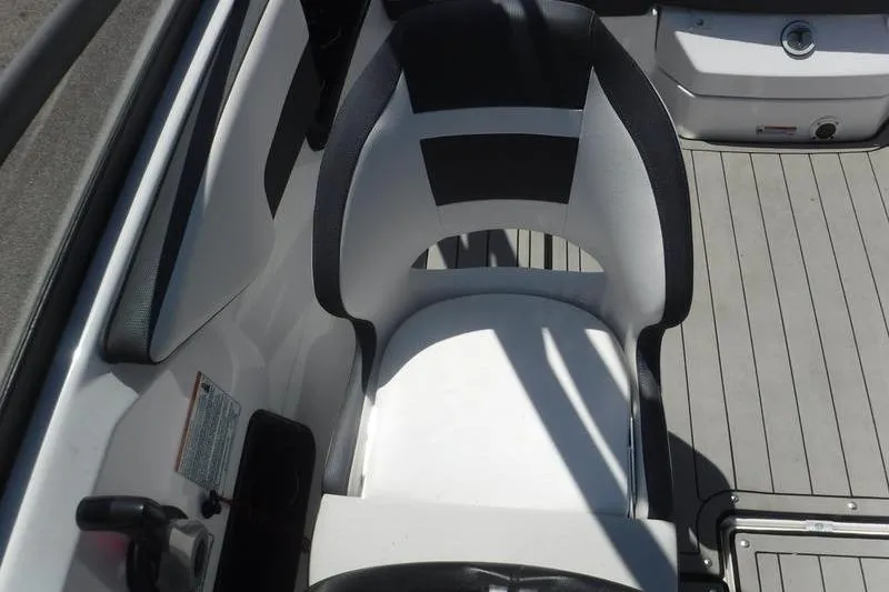 Slide: The Image of 2020 Yamaha Boats 195S interior seat with sleek black and white design. - 15