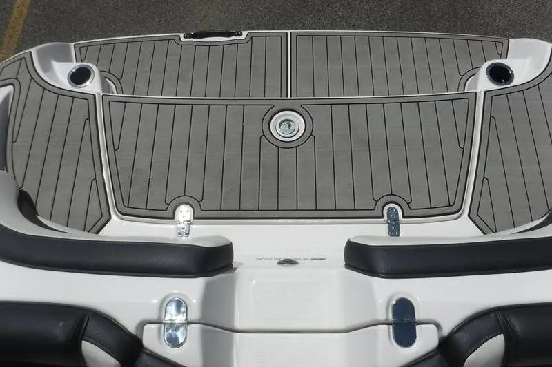 Slide: The Image of 2020 Yamaha Boats 195S swim platform with sleek gray decking and cup holders. - 17