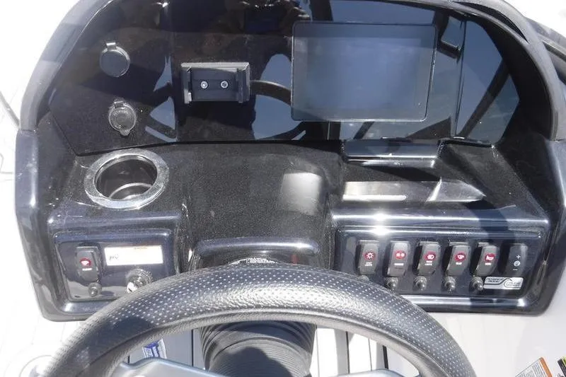 Slide: The Image of Dashboard of 2020 Yamaha Boats 195S with steering wheel and control panel. - 19