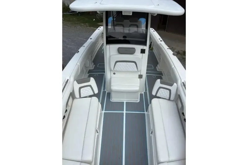 Slide: The Image of 2020 World Cat 280 CC-X boat interior with cushioned seating and sleek design. - 4