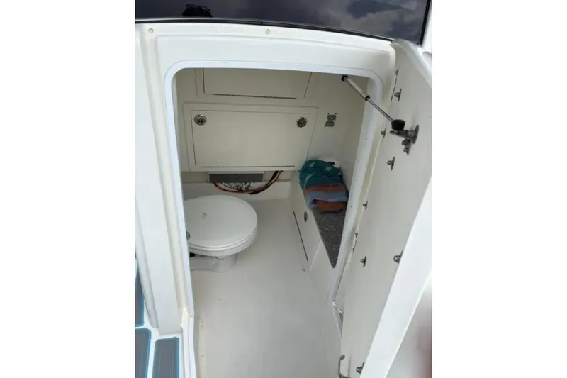 Slide: The Image of 2020 World Cat 280 CC-X boat interior with toilet and storage compartment. - 7