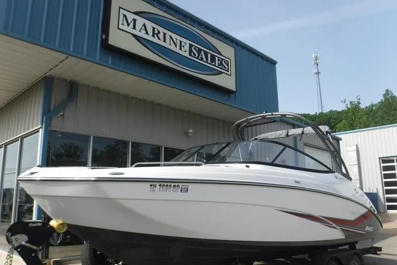 Slide: The Image of 2019 Yamaha AR240 boat displayed at Marine Sales dealership. - 2