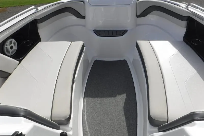 Slide: The Image of 2019 Yamaha Boats AR240 interior with cushioned seating and speaker system. - 6