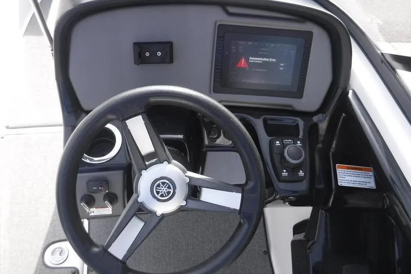 Slide: The Image of 2019 Yamaha Boats AR240 dashboard with steering wheel and control panel display. - 9