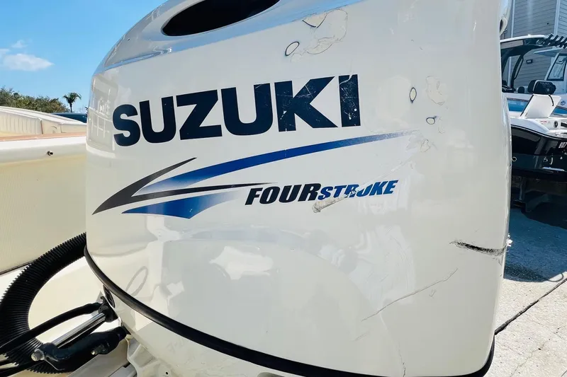 Slide: The Image of Suzuki Four Stroke engine on a 2003 Scout 235 Sportfish boat. - 11