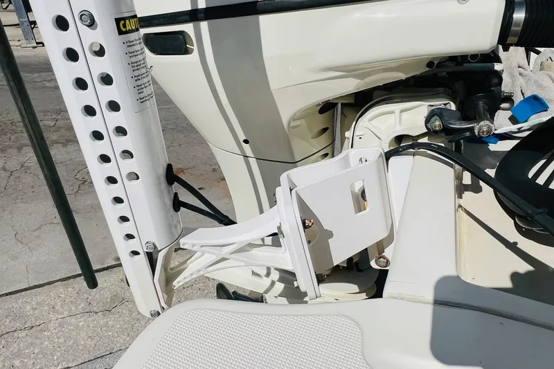 Slide: The Image of Close-up of 2003 Scout 235 Sportfish boat engine and mounting components. - 12
