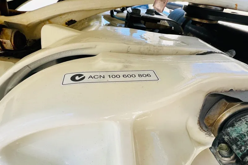 Slide: The Image of Close-up of a 2003 Scout 235 Sportfish engine component with ACN 100 600 806 label. - 13