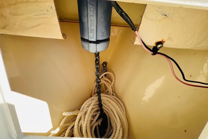 Slide: The Image of Anchor chain and rope in a 2003 Scout 235 Sportfish boat compartment. - 5