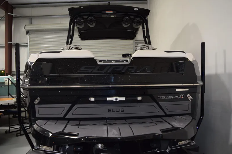 Slide: The Image of 2023 Supra SA boat in a garage, showcasing sleek design and advanced features. - 4