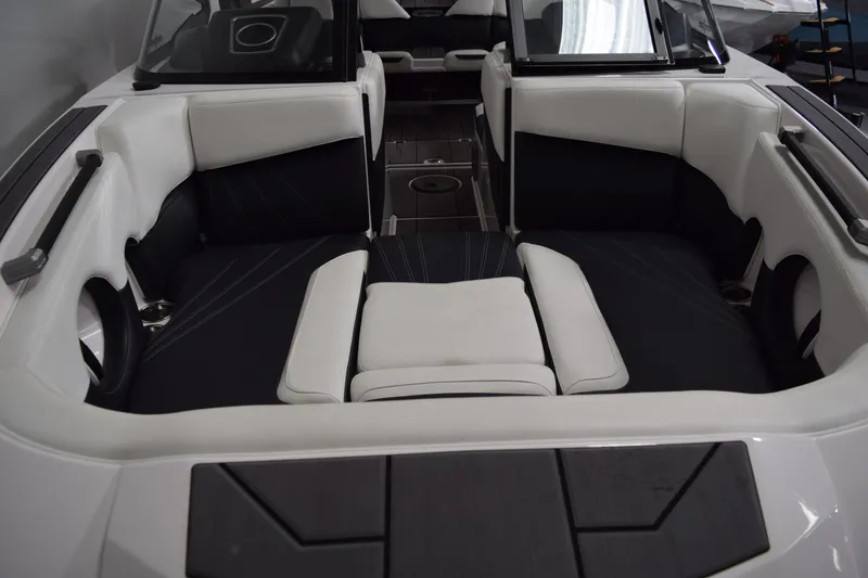 Slide: The Image of 2023 Supra SA boat interior with white and black seating, modern design. - 7