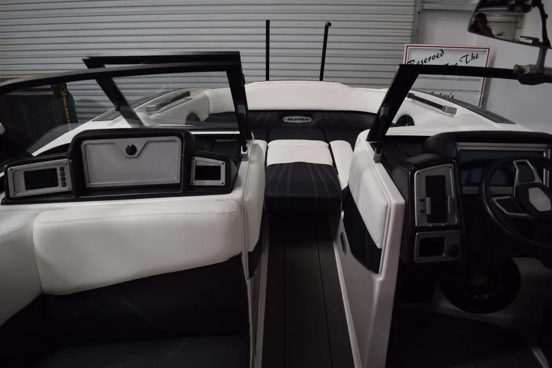 Slide: The Image of 2023 Supra SA boat interior with modern dashboard and seating. - 8