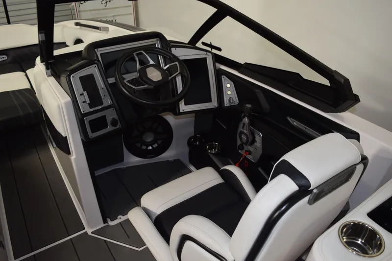 Slide: The Image of 2023 Supra SA boat interior with modern steering and control panel. - 9