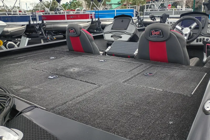 Slide: The Image of 2021 Ranger RT198P boat interior with dual seats and spacious deck. - 4