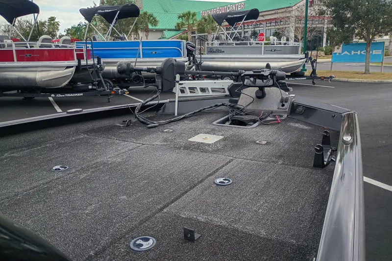 Slide: The Image of 2021 Ranger RT198P boat deck in parking lot with other boats in background. - 6