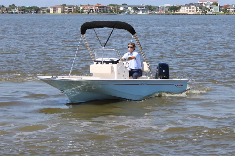 Slide: The Image of 2026 Boston Whaler 150 Montauk on calm waters. - 1