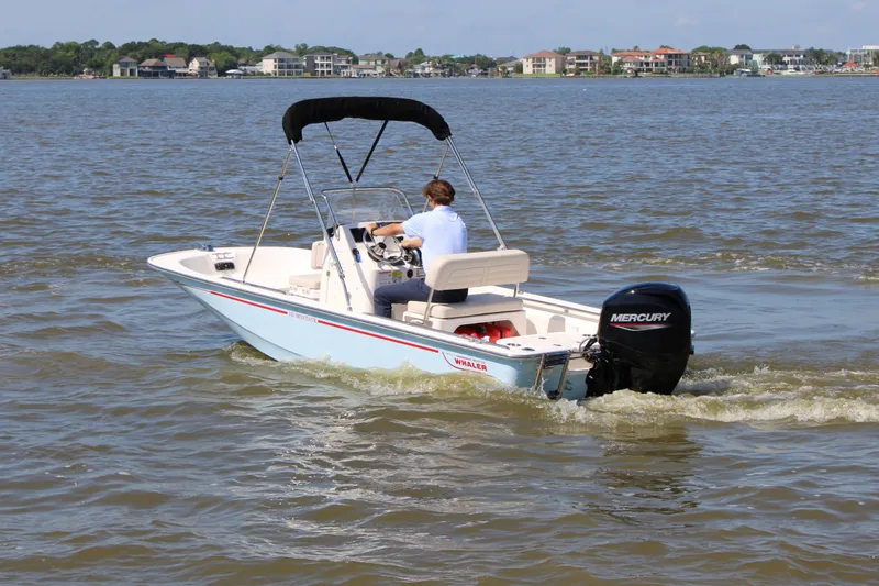 Slide: The Image of 2026 Boston Whaler 150 Montauk on calm waters. - 11