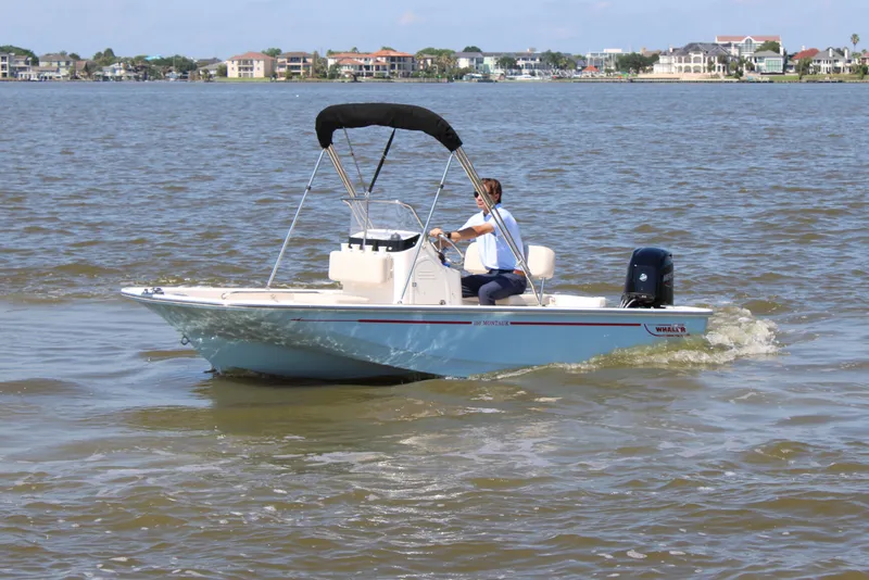 Slide: The Image of 2026 Boston Whaler 150 Montauk on calm waters. - 12