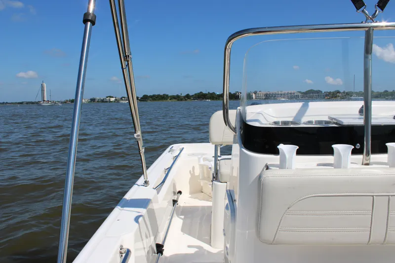Slide: The Image of Boston Whaler 150 Montauk 2026 on calm waters with clear skies. - 18