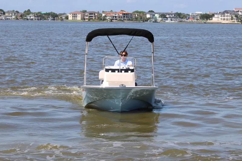 Slide: The Image of 2026 Boston Whaler 150 Montauk on calm waters. - 2