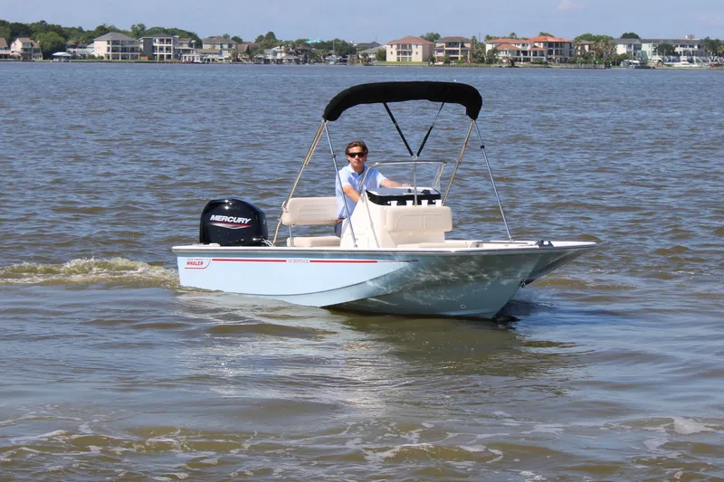 Slide: The Image of 2026 Boston Whaler 150 Montauk on calm waters. - 3