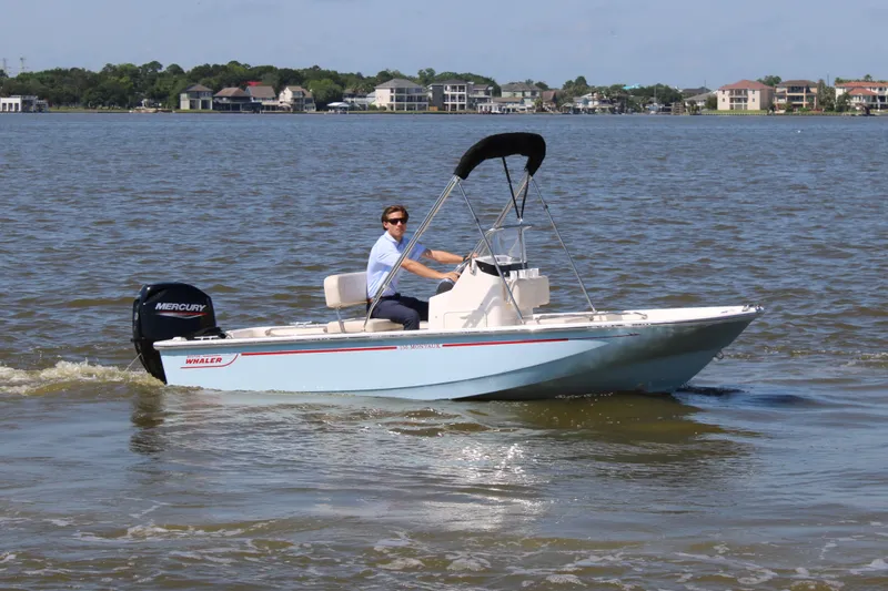 Slide: The Image of 2026 Boston Whaler 150 Montauk on a calm lake. - 4