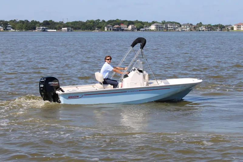 Slide: The Image of 2026 Boston Whaler 150 Montauk on calm waters. - 5