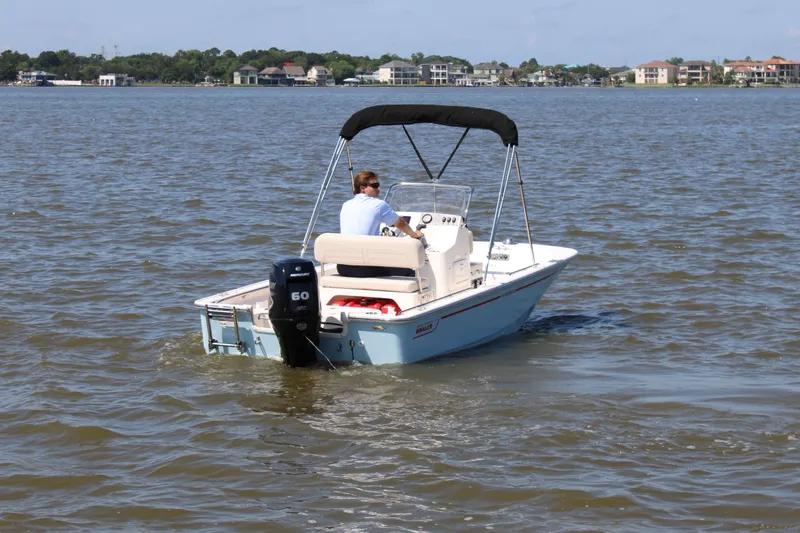 Slide: The Image of 2026 Boston Whaler 150 Montauk on calm waters. - 8