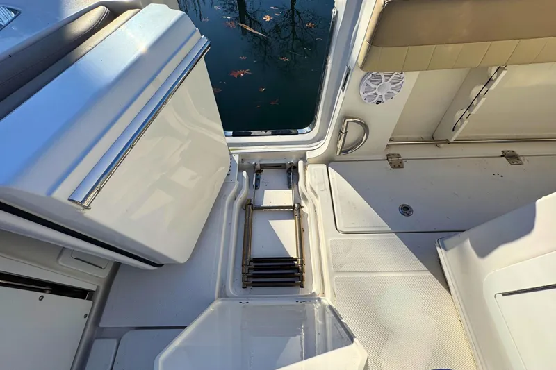 Slide: The Image of 2020 Sailfish 360 CC boat interior with ladder and ocean view. - 10
