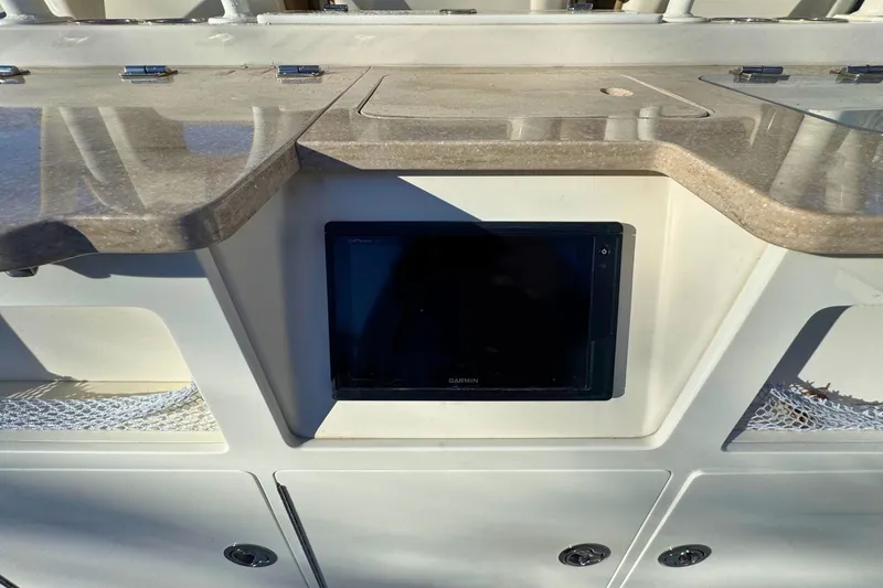 Slide: The Image of 2020 Sailfish 360 CC boat interior with fishing station and ocean view. - 12
