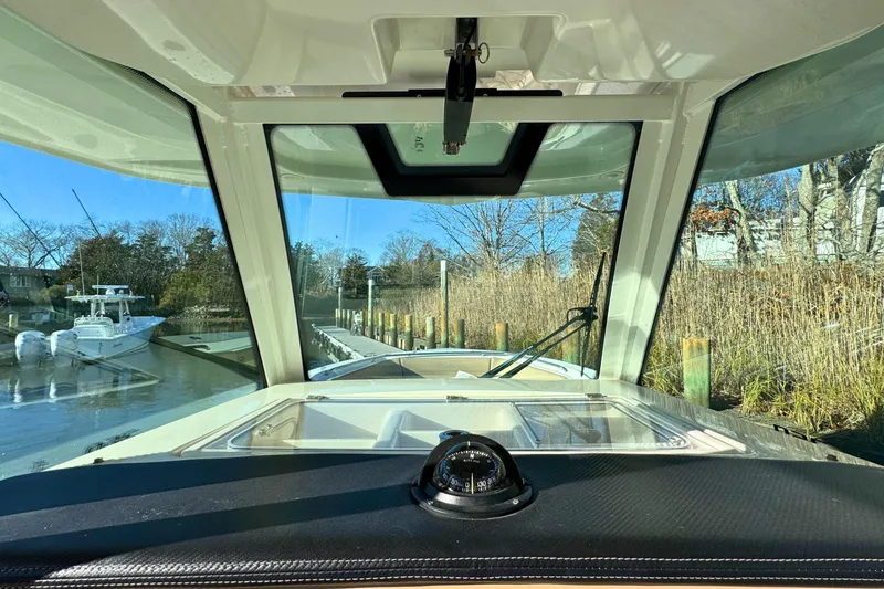 Slide: The Image of View from 2020 Sailfish 360 CC boat cockpit, overlooking open ocean and clear sky. - 18