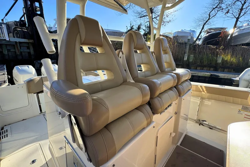 Slide: The Image of Control panel of 2020 Sailfish 360 CC boat with Garmin device and switches. - 22