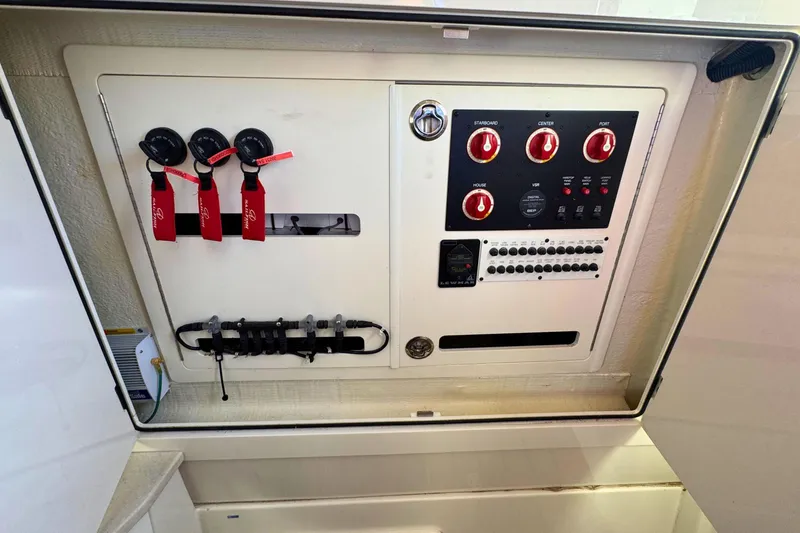 Slide: The Image of Electrical control panel of a 2020 Sailfish 360 CC boat, featuring switches and gauges. - 39