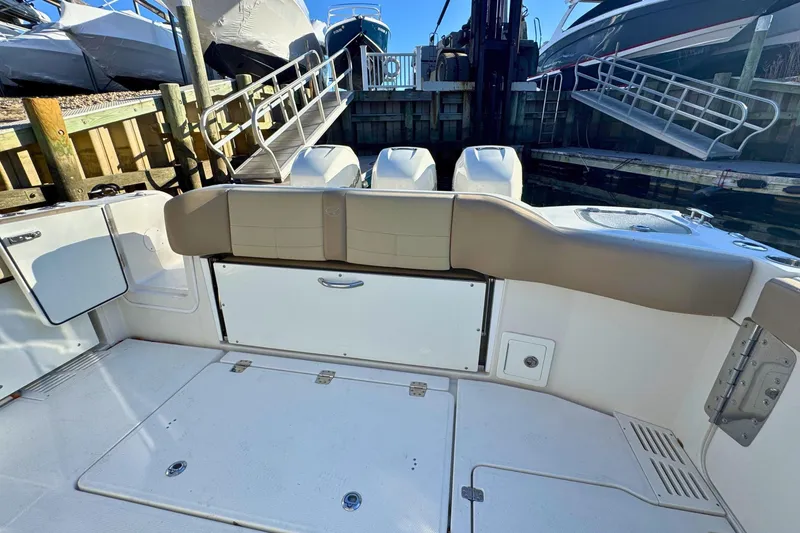 Slide: The Image of 2020 Sailfish 360 CC boat deck with triple engines on open water. - 4