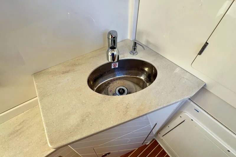 Slide: The Image of 2020 Sailfish 360 CC boat interior sink with modern faucet and countertop. - 41
